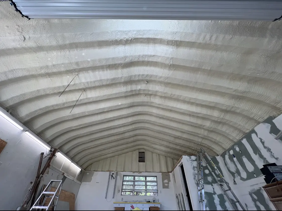 Spray polyurethane foam applied to the underside of a metal roof deck in Upper Merion
